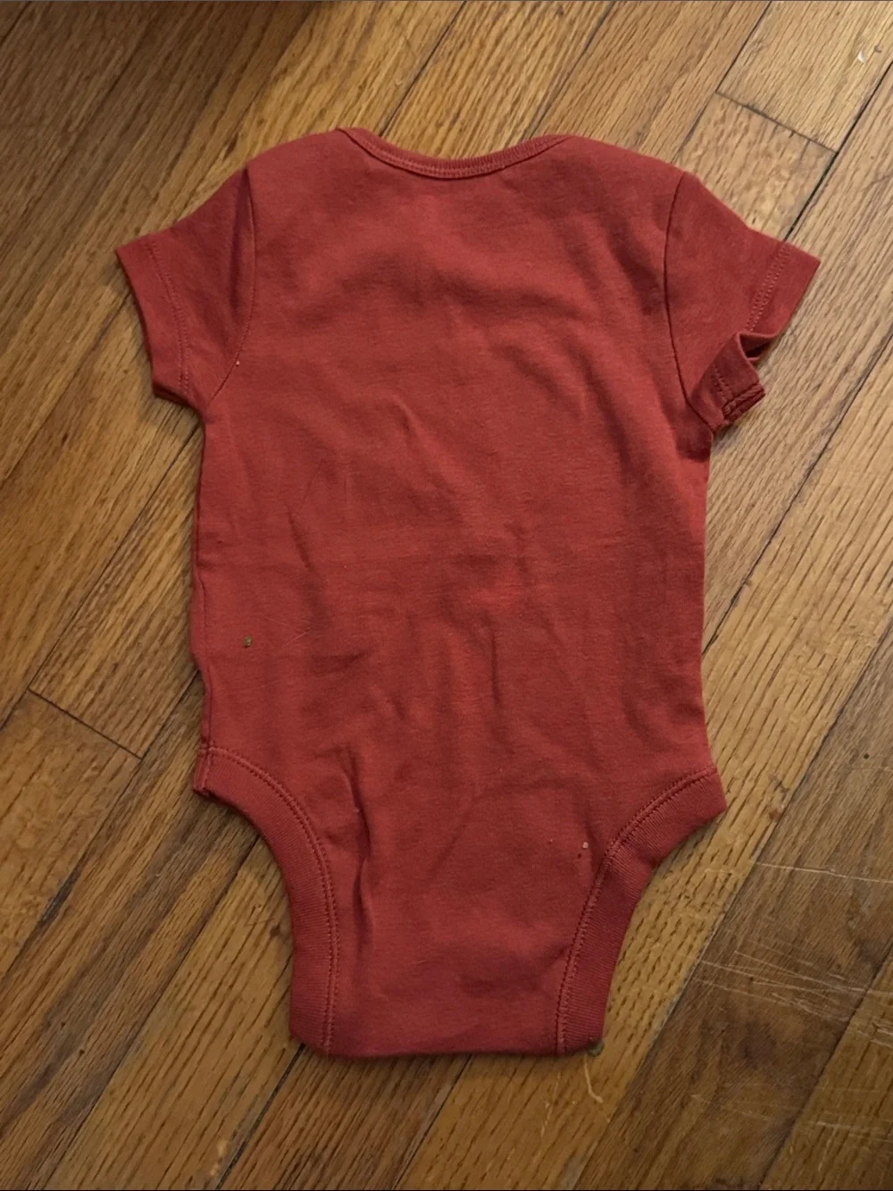 Infant short sleeve, Sepia/ Rust Onesie  with “Best Nephew Ever” Graphic.  NWOT